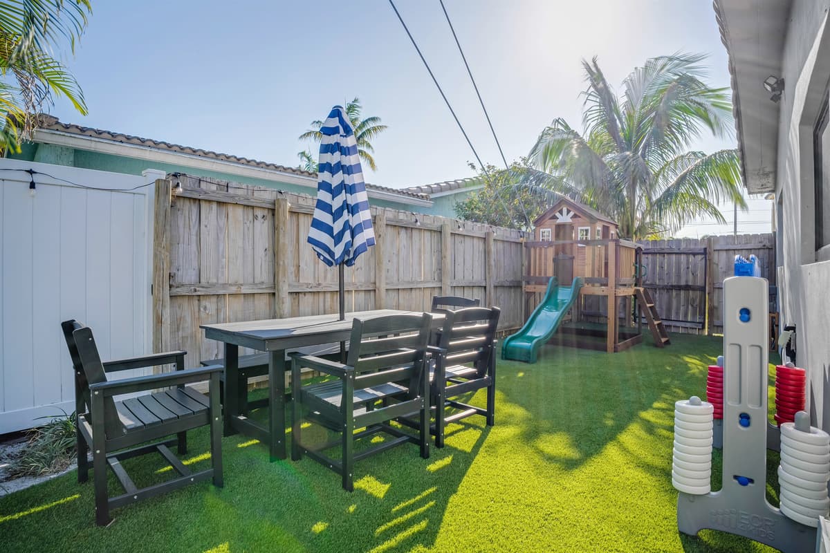 Don't worry about entertaining the kids, relax at the shaded table while they play nearby