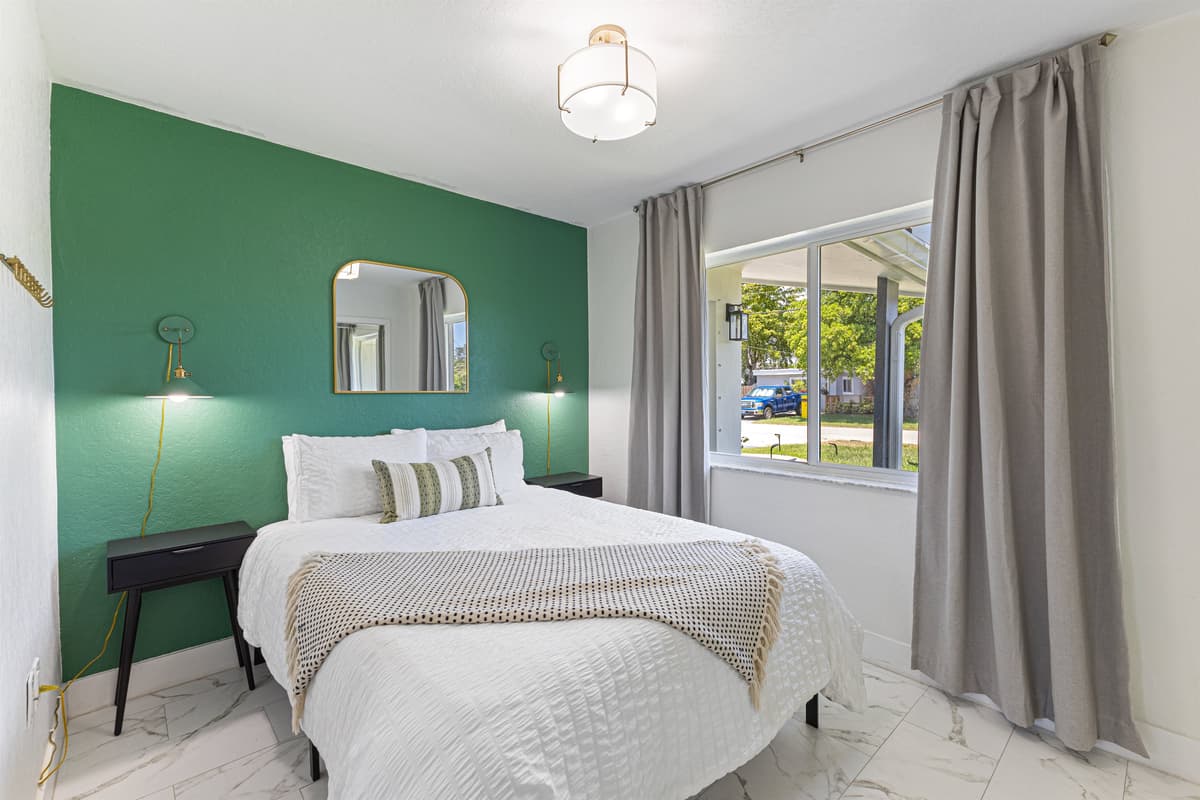 Third bedroom — Queen bed, plush bedding, and stylish touches.
